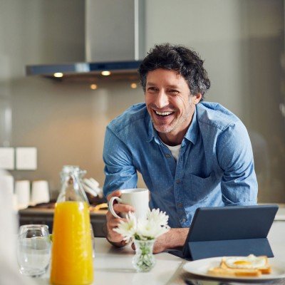 Smiling man enjoys a conversation with his wife after applying for an Expat Buy to Let mortgage with the Marsden.
