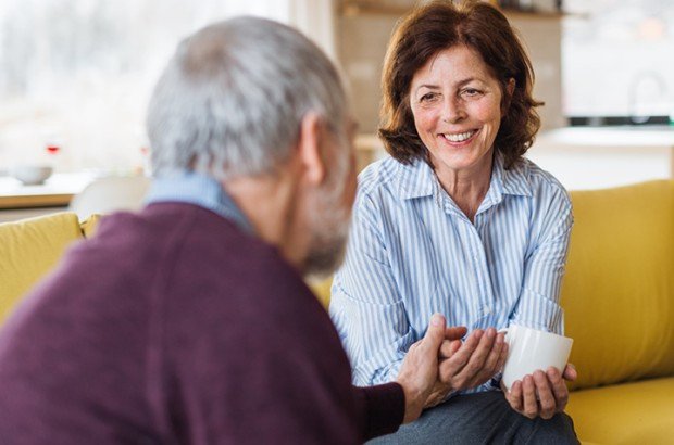 Mature woman sits in her home after applying for an Older Borrower mortgage with the Marsden via her mortgage advisor.