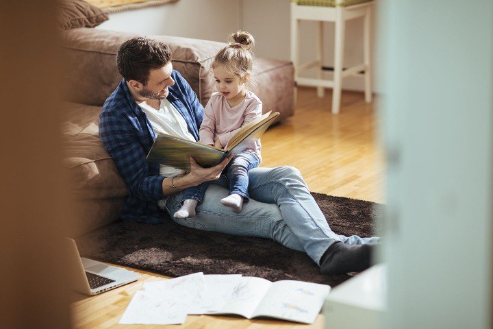 Smiling father spends time with his young daughter after applying for a Shared Ownership mortgage with the Marsden.