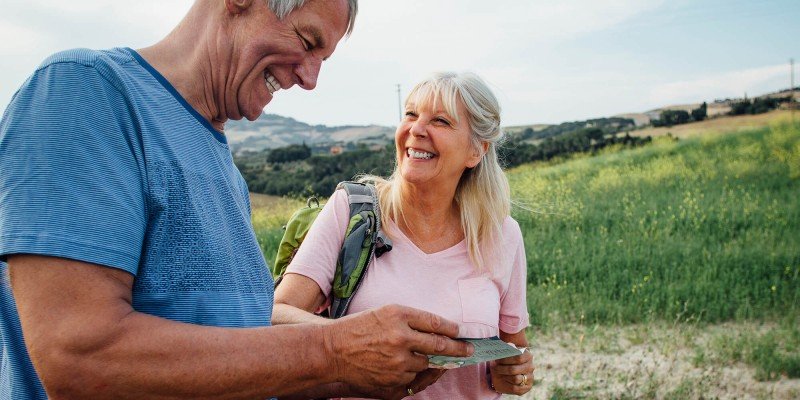 Couple walking and smiling outdoors