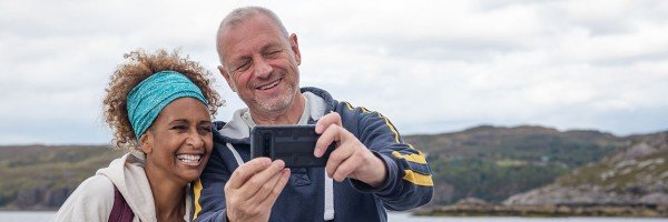 Couple talking a selfie outdoors | Furnished Holiday Let mortgage case study