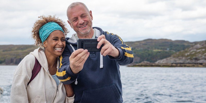 Couple talking a selfie outdoors | Furnished Holiday Let mortgage case study